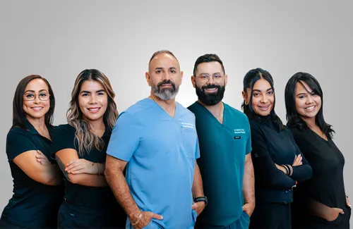 Chiropractor Kissimmee FL Roberto Arias With Team